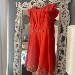 Gorgeous orange cocktail dress!